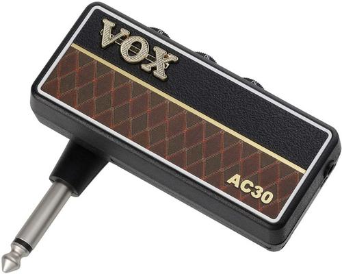 une Guitare Vox Ampli