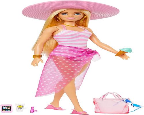 un Jeu Barbie Plage Mannequin Blonde Avec Maillot De Bain Rose Et Blanc