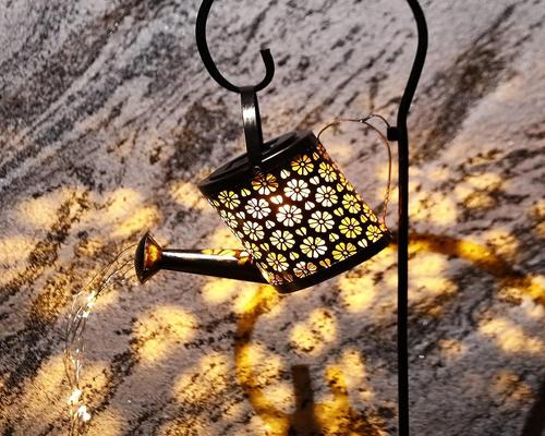 a Tigerkinwit Solar Lamp in the Shape of a Watering Can