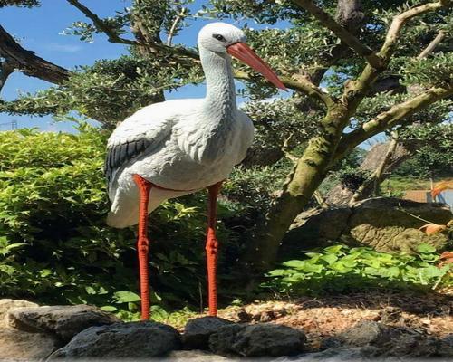 a white stork statue